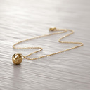 THE WORLD IS MINE. Short necklace with a globe