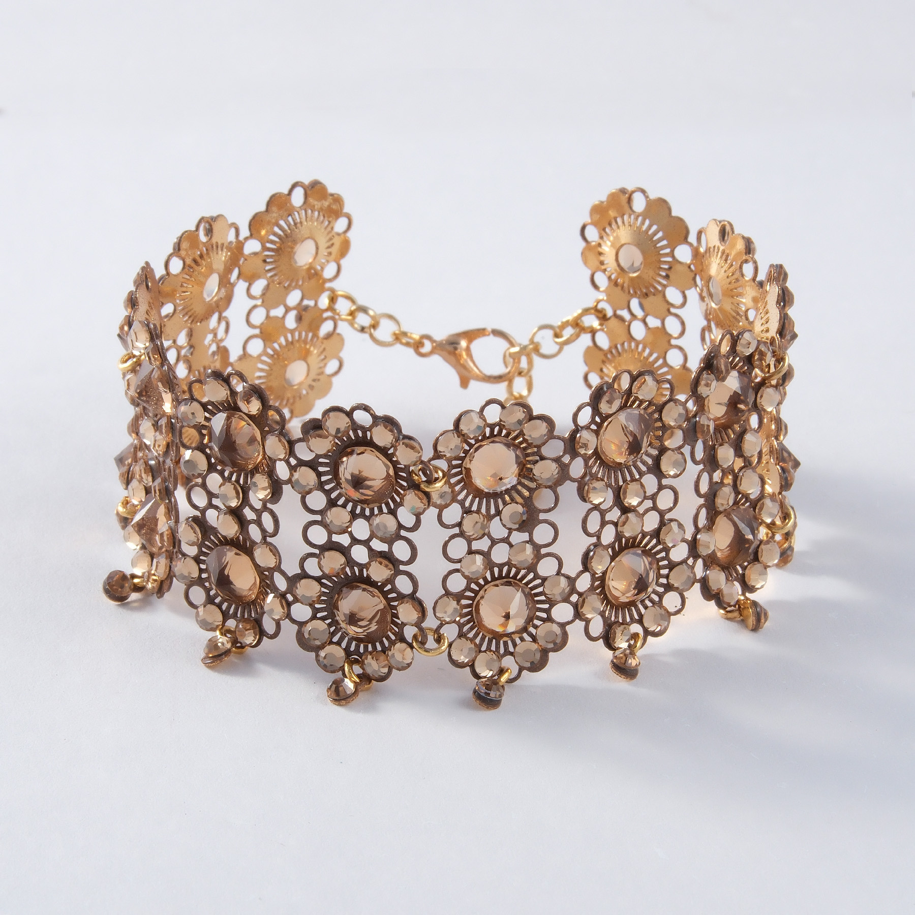 Bransoletka z modułów w ciepłym złocie z kwiatkami. MILLA FIORI