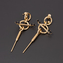 Pozłacane kolczyki z dwoma czarnymi kryształkami. FEMMES EN NOIR