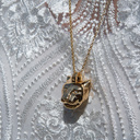 Pozłacany wisiorek z zawieszką z głową pantery i cyrkoniami. KSIĘŻNA DŻUNGLI